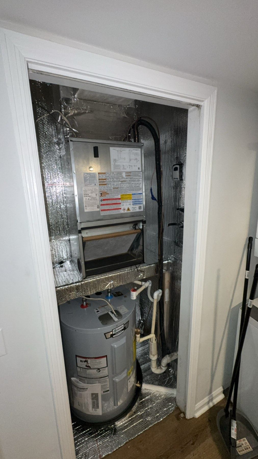 Indoor air handler installed in a utility closet